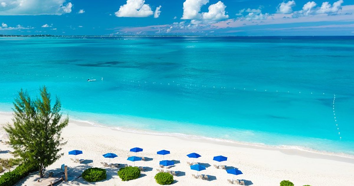 An aerial view of the white sand and turqouise waters of Grace Bay Beach.